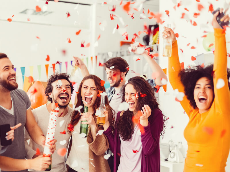 Group of coworkers at office holiday party despite hearing loss